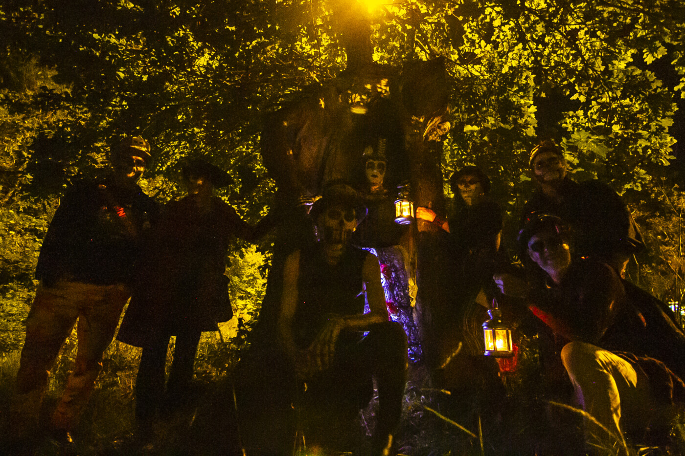 a group of people dressed as skeletons are gathered around the worthing midsummer oak tree