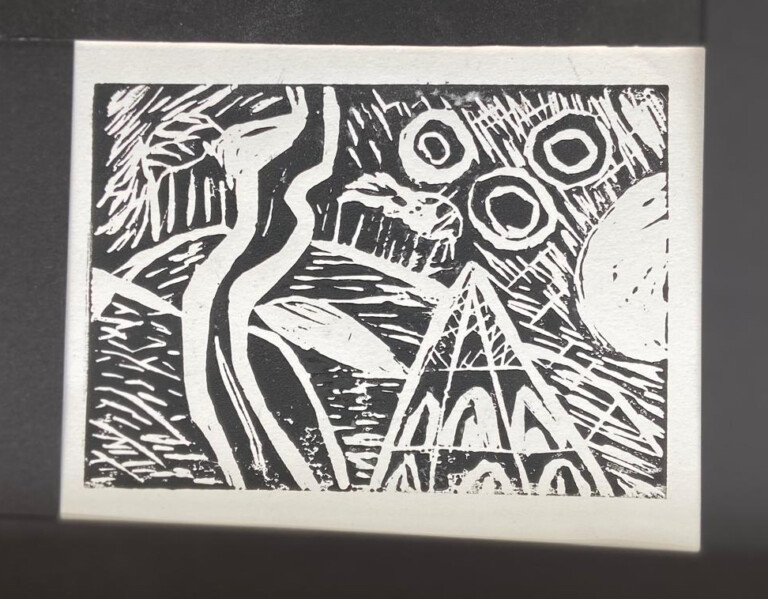 a black and white Lino cut print, it is a stylised image of a roman temple on Chanctonbury Ring, a hill fort in West Sussex