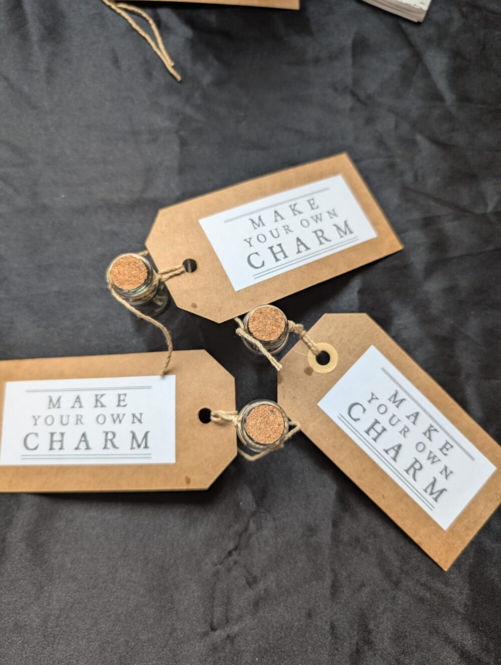 small bottles are labeled with 'make your own folk charm'
