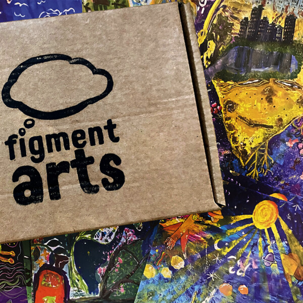 a cardboard box, stamped with the Figment Arts logo. Behind it are colourful postcard designs